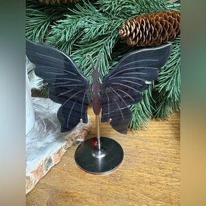 black obsidian crystal butterfly wings on a metal stand. Repaired